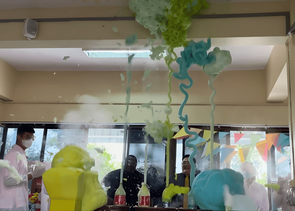 Colorful Elephant’s Toothpaste reaction erupting during the SPR BFITS Program hand-on Chemistry science lab experiment