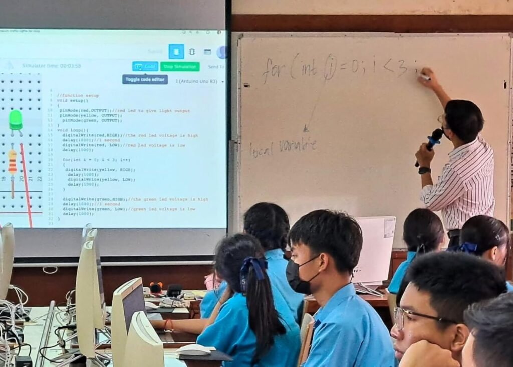 SPR BFITS Program students coding an Arduino project in the computer lab with Teacher Neil Rusia