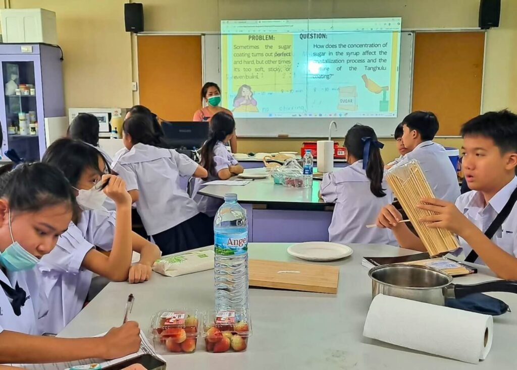 SPR BFITS Program students working on a hands-on science project about sugar and tanghulu with Teacher Ada Mangaoang