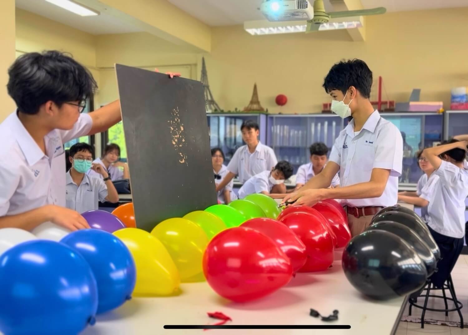 SPR BFITS Program Students doing Science experimentation on Absorption and Reflection of Light